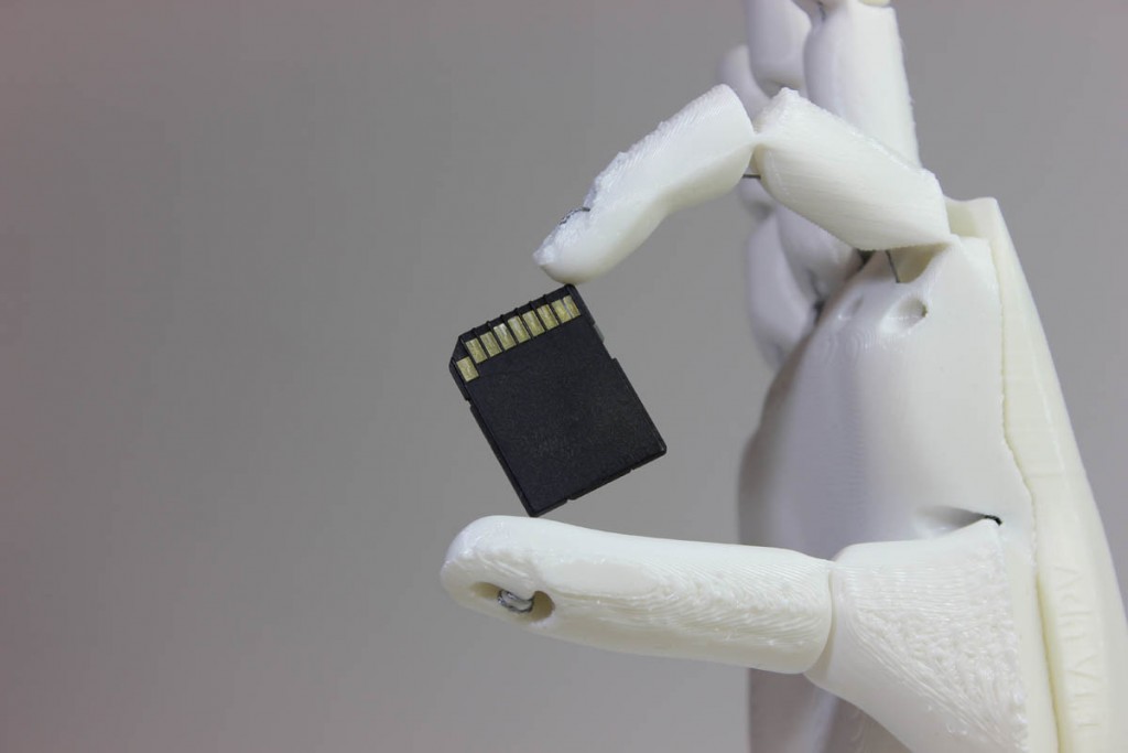 open bionic 3D printed hand ada holding sd card