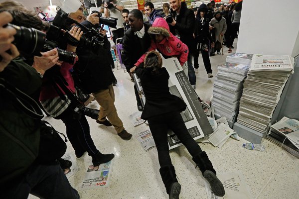 A Black Shopper getting carried away. Photo via Reuters.