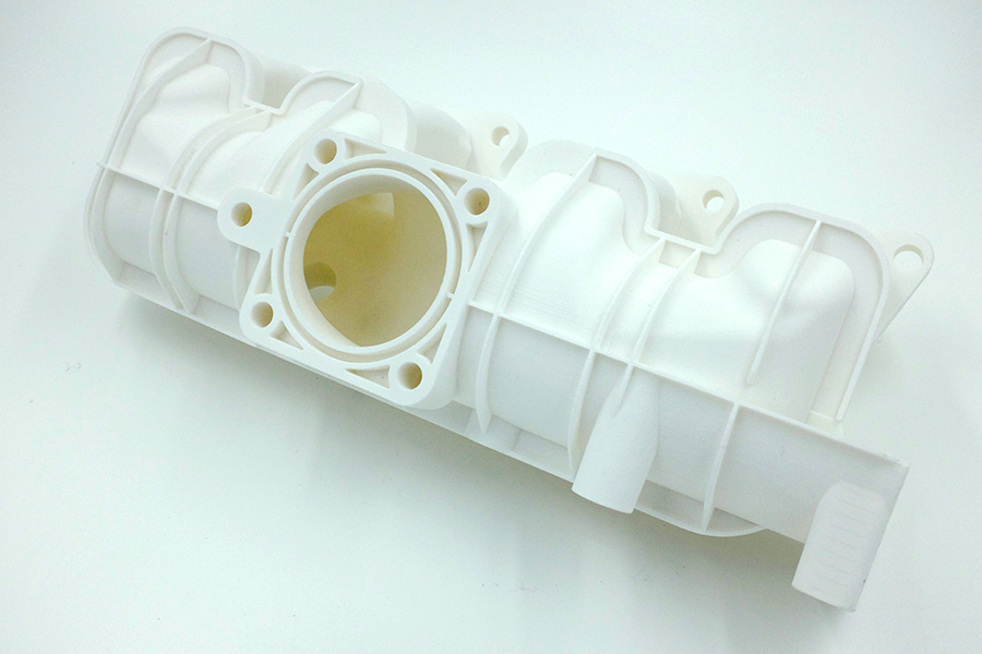 A 3D printed plastic car part by Farsoon. Image via: the company's website
