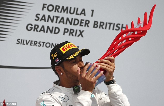 Hamilton kisses the 3D printed trophy before criticizing it for looking cheap. Image via 3DPrint.