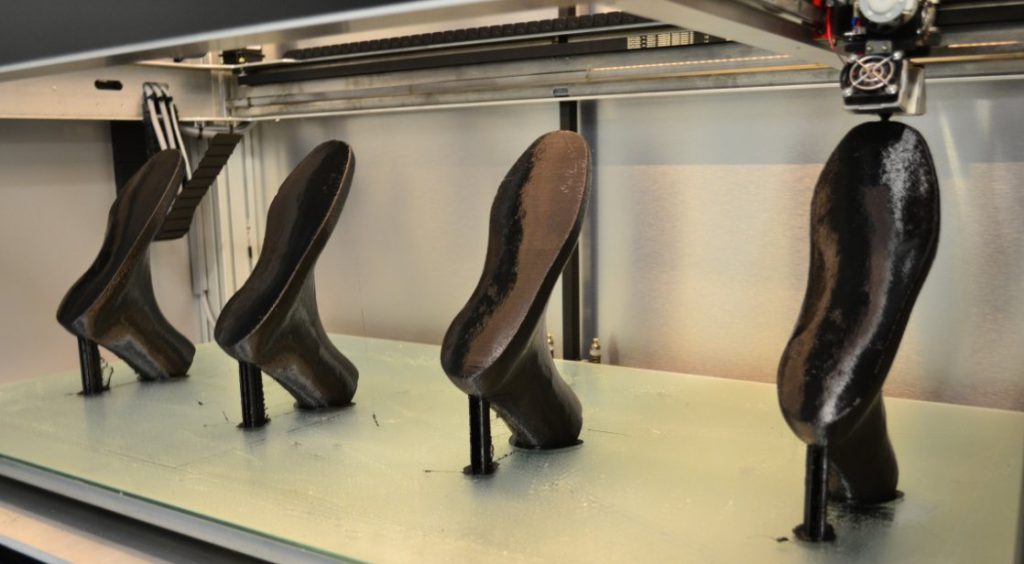4 shoe prototypes printed alongside each other on the Extreme 1500. Photo via: Builder3DPrinters on Twitter