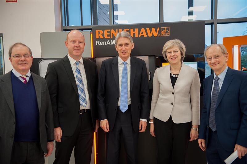 Sliced: Theresa May and the Chancellor of the Exchequer at Renishaw HQ in Gloucestershire. Photo via: machinery.co.uk