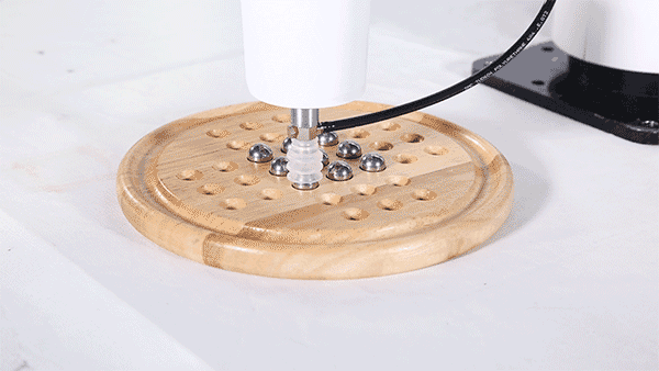 The dobot can pick and place using suction cups. Gif via Dobot.