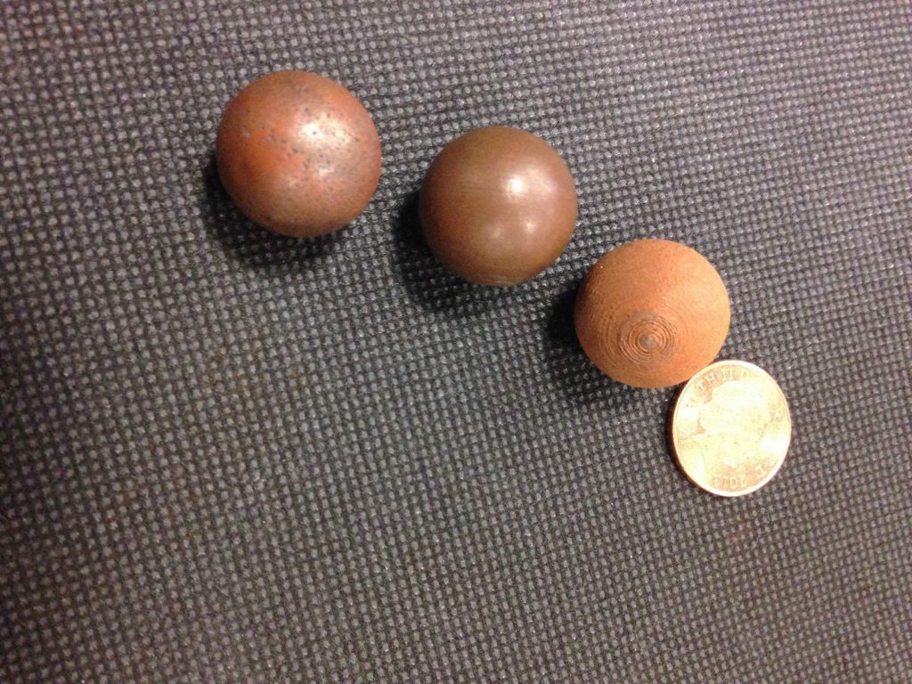 From left to right: sphere fired in the kiln; polished sphere; one simply 3D printed in copper PLA, and a 1p coin for comparison. Photo via: Beau Jackson for 3DPI