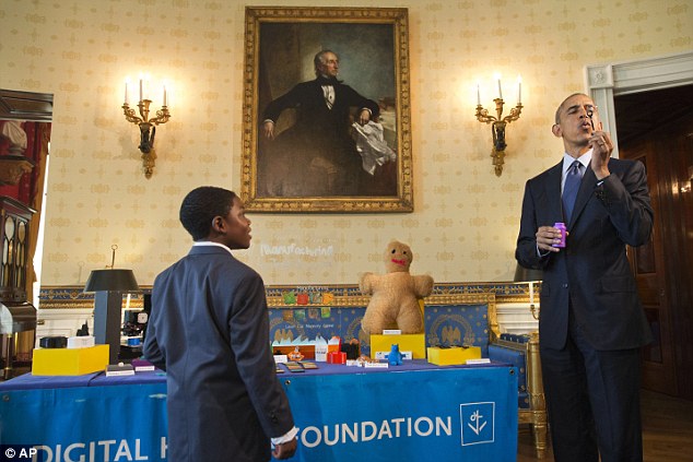 The National Week of Making at the White House. President Obama tries Jacob Leggette's 3D printed bubble wand. Also in the collection: 3D printed cups, bowls, cookie cutters, and a replica of the White House. Photo via: AP