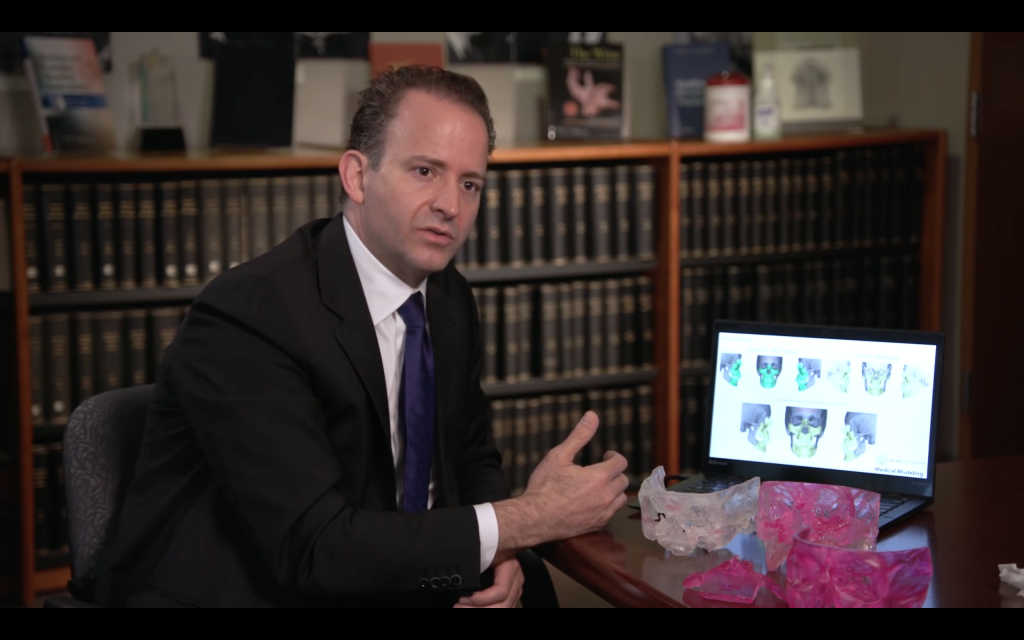 Dr. Samir Mardini with 3D printed facial models by 3D Systems. Screenshot via Mayo Clinic on YouTube