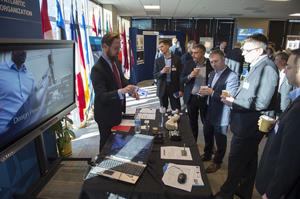 3D Printing Industry's Michael Petch demonstrates Optomec's 3D printed electronics to NATO during Allied Command Transformation event in Virginia.