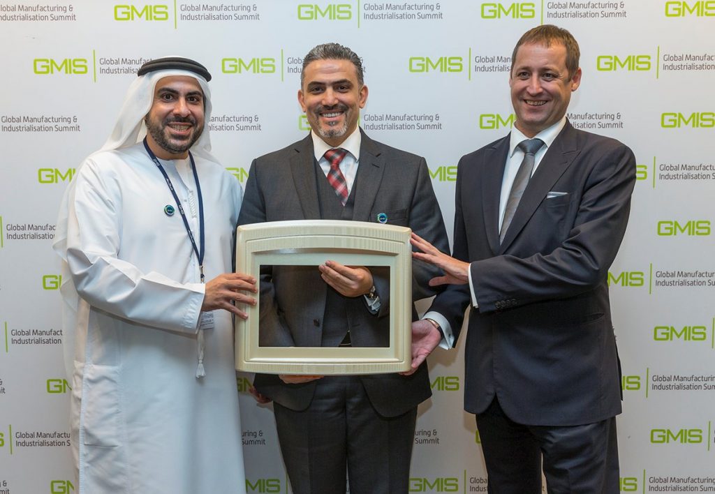 Representatives of Strata Manufacturing, Etihad Airways, and Siemens hold the 3D printed part at the Global Manufacturing and Industrialization Summit. Photo via Siemens Middle East