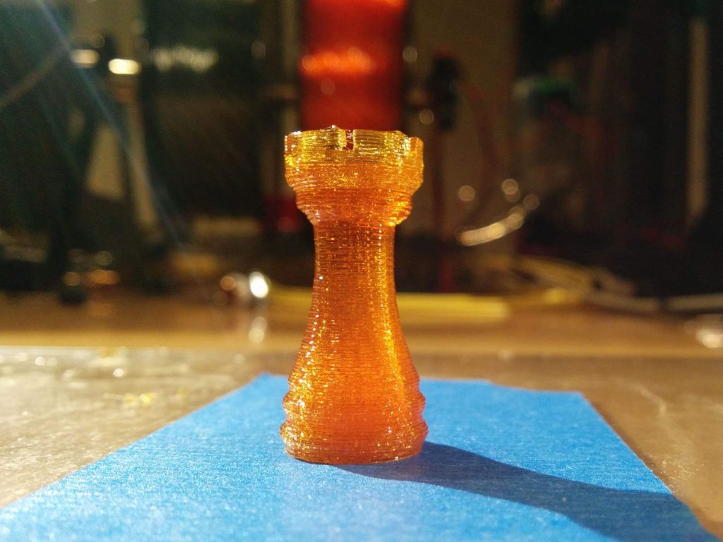 Rook printed from melted sugar glass using Aether's heated glass syringe. Photo via Aether.