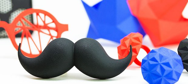 A collection of 3D printed objects post processed by the DyeMansion Powershot S system. Featuring Bow Tie Mustache by UTB. Photo via Shapeways