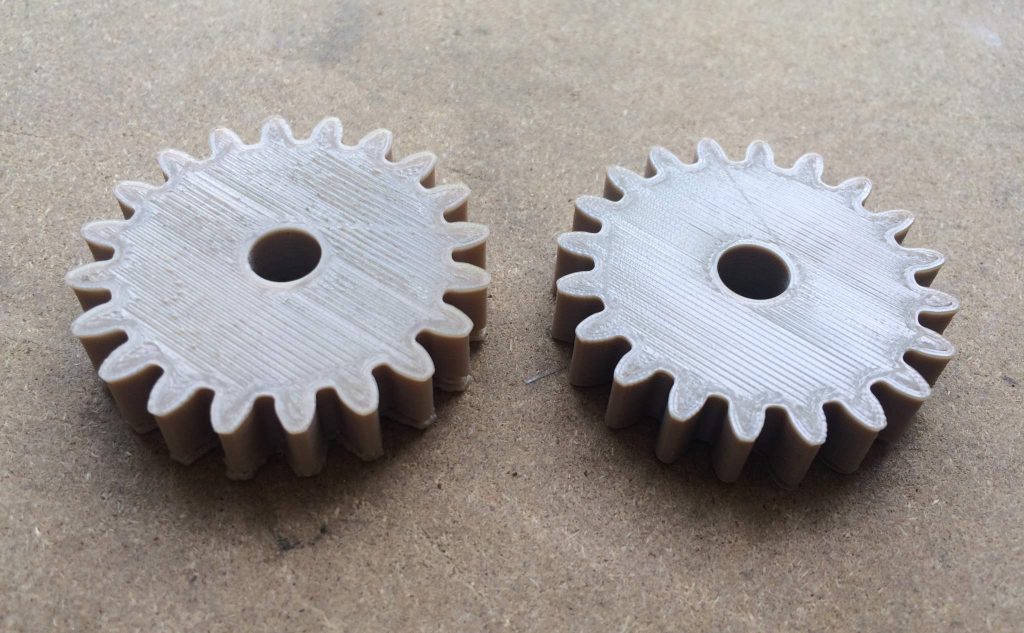 Mechanical cogs 3D printed in PEEK on the FUNMAT HT. Photo by Beau Jackson