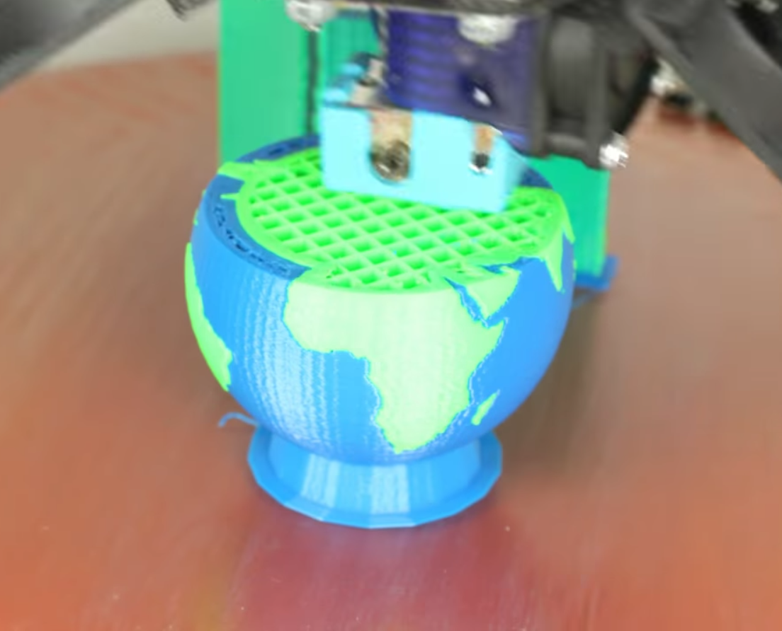 3D printed globe using the Prometheus multi-material system. Image via DisTech Automation. 