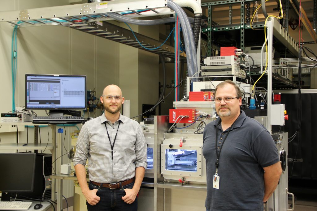 Brandon Lane (left) and Steve Grantham (right) in front of the NIST AMMT/TEMPS system.