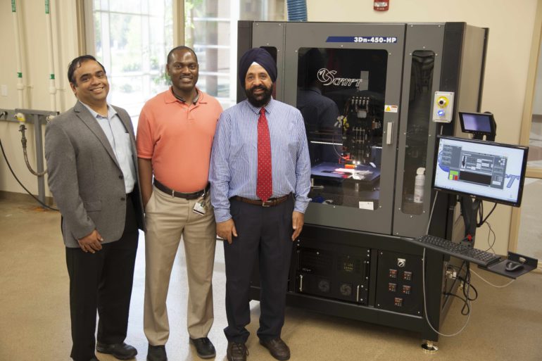 From FAMU News Professors Ramakrishnan, Dickens and Sachdeva (left to right) in front of the high-resolution 3D printer that will be used to manufacture novel materials and devices.