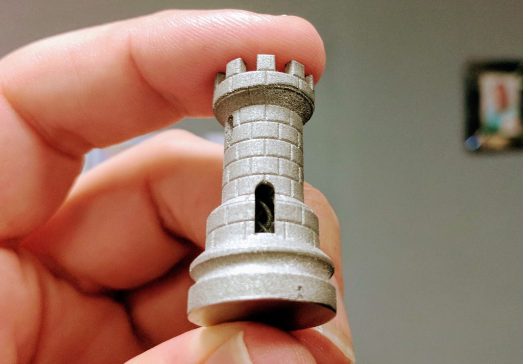 A metal 3D print of the classic rook and double helix from the ORLAS CREATOR. Photo by Michael Petch.