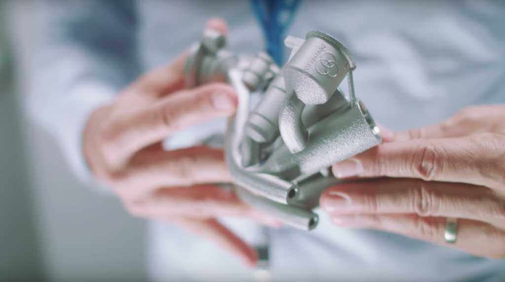 A metal 3D printed engine part printed by Thyssenkrupp. Photo via Youtube/Thyussenkrupp.