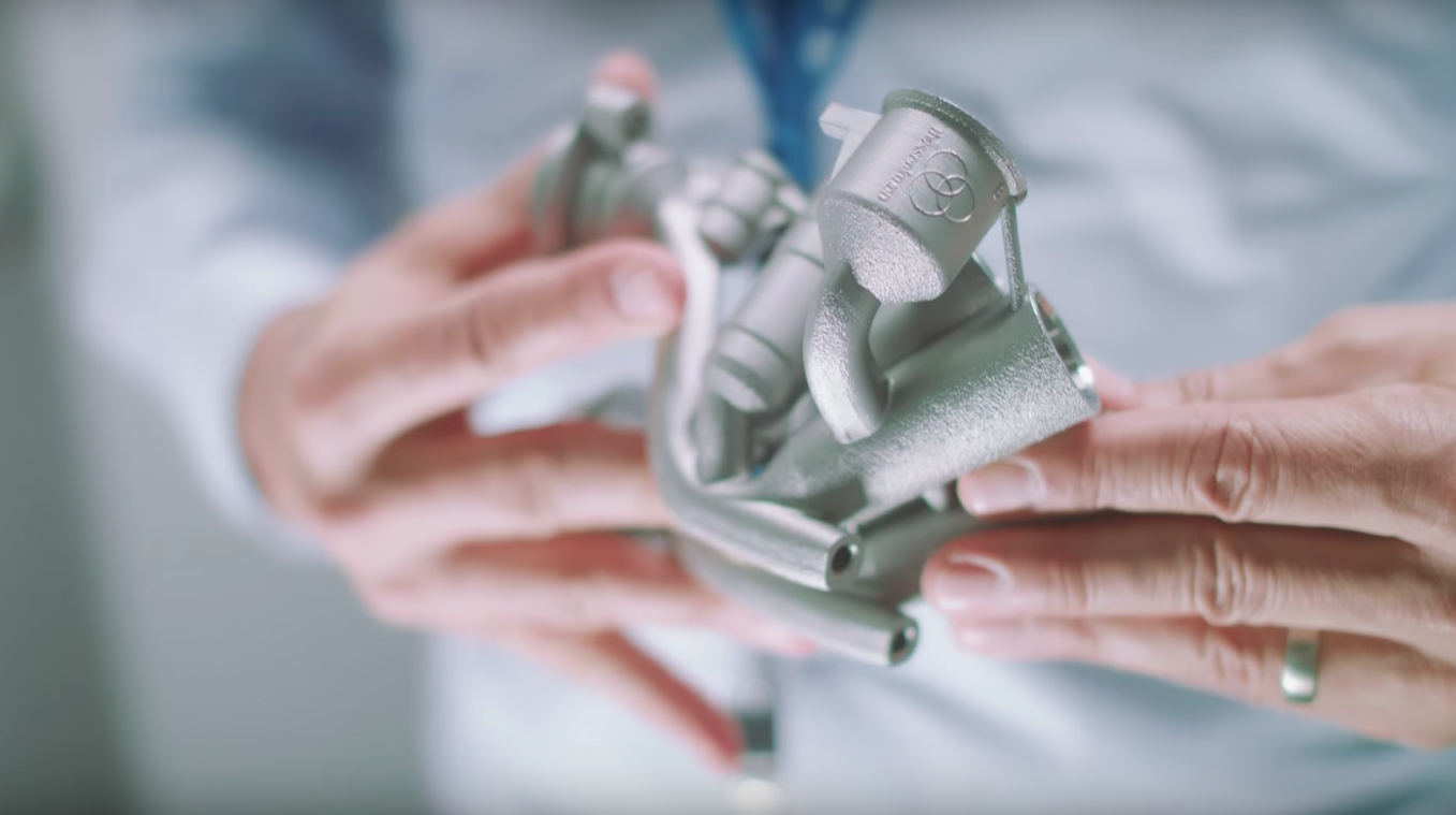 A metal 3D printed engine part printed by Thyssenkrupp. Photo via Youtube/Thyussenkrupp.