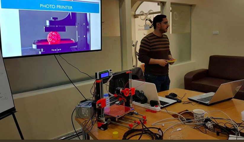 Muttar demonstrates a self-assembled 3D printer. Picture via