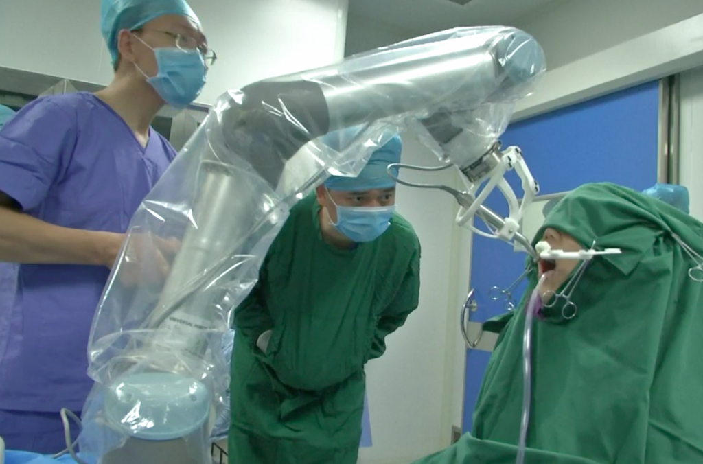 3D printing was used to practice this robot guided oral procedure. Photo via South China Morning Post.