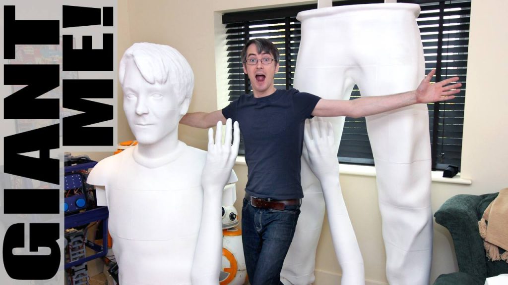 James Bruton next to pieces of the giant version of himself. Photo via XRobots.