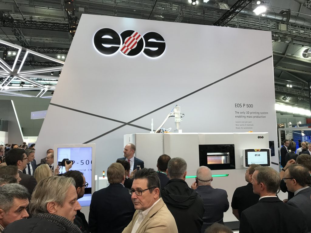 A crowd forms around for the unveiling of the EOS P500 machine led by CTO Tobias Abeln.