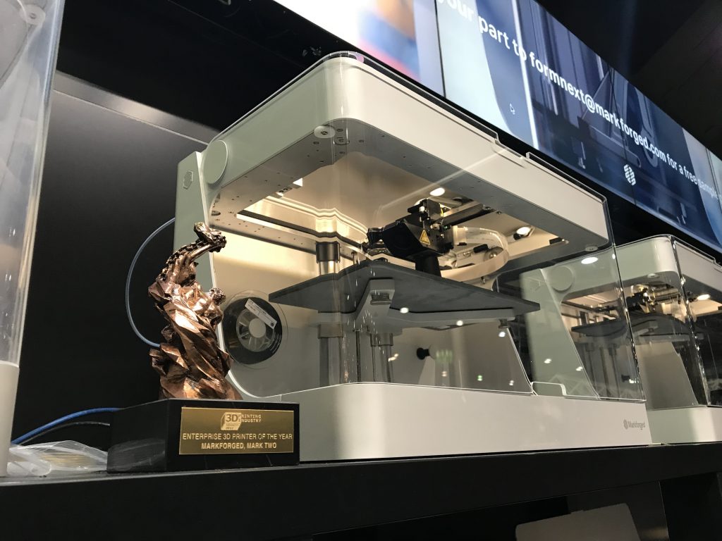 The 3D Printing Industry Awards trophy sitting pretty at Markforgeds formnext booth. Photo by Beau Jackson for 3D Printing Industry