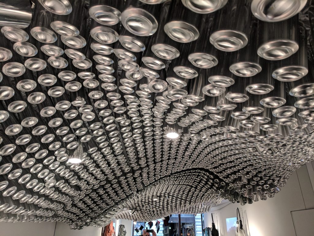The Bottletop store has a 3D printed mesh covered with cans. Photo by Michael Petch.
