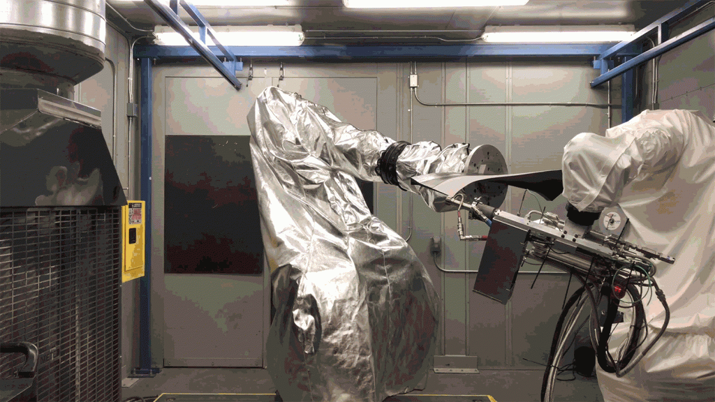 Robotic arms at work with Cold Spray Fusion. Photo via GE.