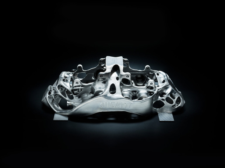 Bugatti's "world first" SLM 3D printed brake caliper. Photo via Bugatti Automobiles S.A.S.