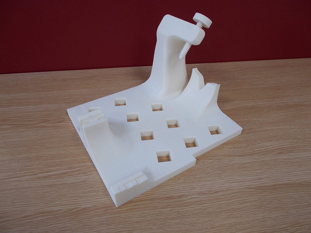 A bespoke CMM fixture 3D printed for Moog. Photo via SYS Systems