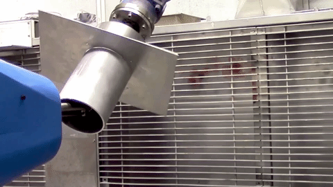 The gas jet fires metal particles on to the interior of a metal cylinder. GIF by Rushabh Haria.