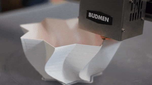 A Budmen BUILDER 3D printer manufacturing a lamp. Image via Budmen Industries.