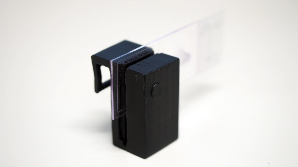 The 3D printed microscope clip-on with slide. Photo via RMIT/CNBP