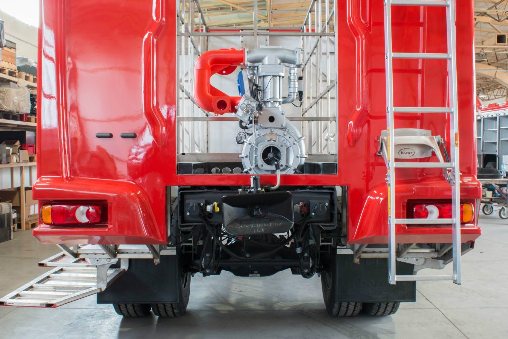 The red 3D printed vacuum manifold installed on a Bocar fire truck. Photo via 3DGence