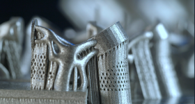 Metal components, 3D printed in a Sintavia machine on a build plate. Photo via Sintavia.