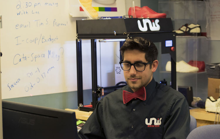 Unis displays a 3D printed bow tie at the LaunchBox. Photo via Samantha Wilson/The Collegian.