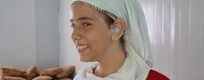 A girl in Jordan provided with hearing aids from HLID.