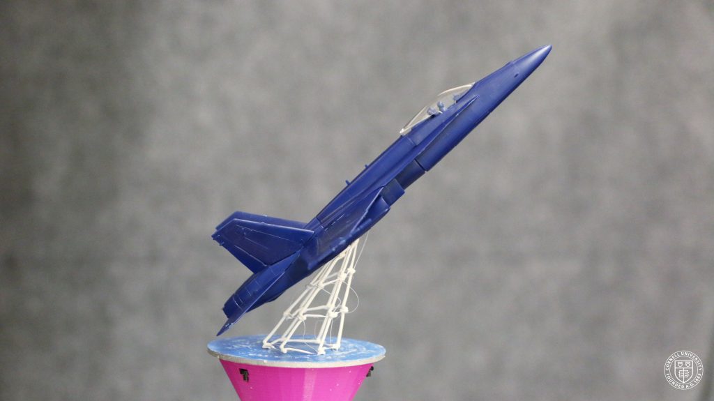 A 3D printed stand on an airplane model, made using RoMA. Photo via Huaishu Peng/Cornell