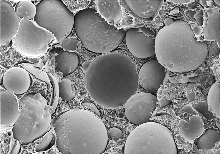 An electron micrograph of syntactic foam with fly-ash microspheres. Image by Nikhil Gupta/NYU