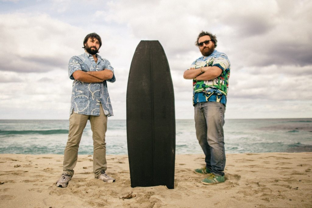 Francesco Belvisi (left) and Daniele Cevola (right) founders of OCORE and a surfboard 3D printed using their proprietary technology. Photo via OCORE