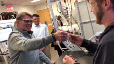 Energy Secretary Rick Perry, left, and Berkeley Lab’s Raymond Weitekamp struggle to break a 3D-printed wish bone at Berkeley Lab’s Molecular Foundry. GIF via Kelly J. Owen for Berkeley Lab.