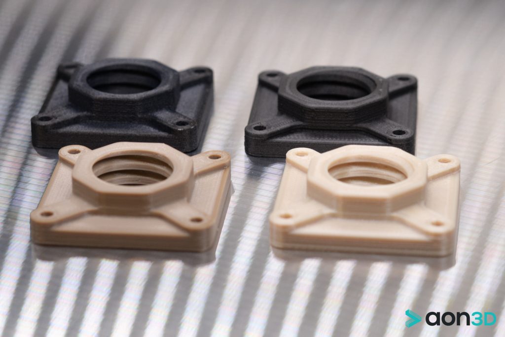 PEEK and ULTEM brackets 3D printed on the AON-M2. Photo via AON3D