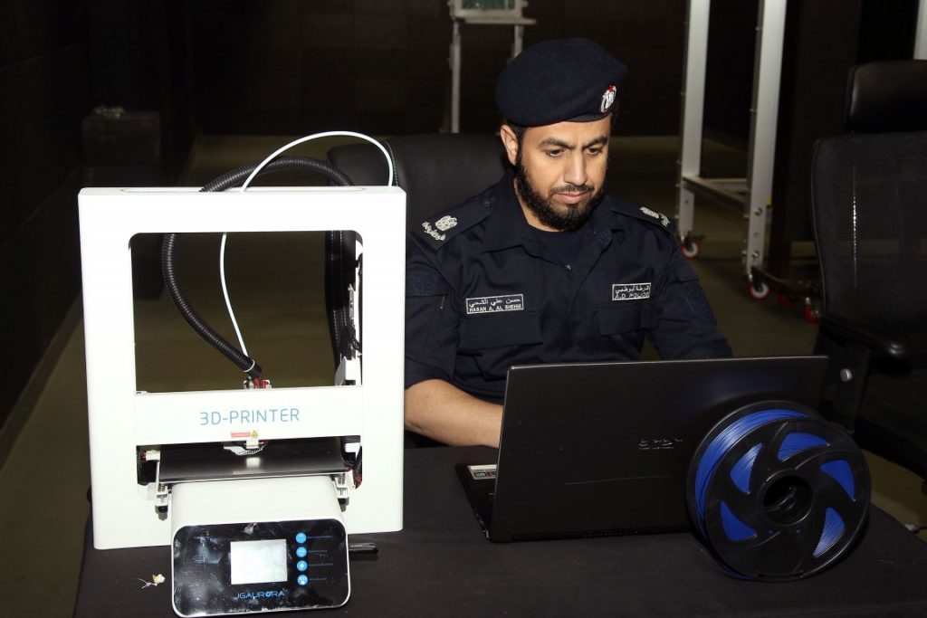 An officer in the Criminal Evidence Administration uses a 3D printer. Photo via WAM