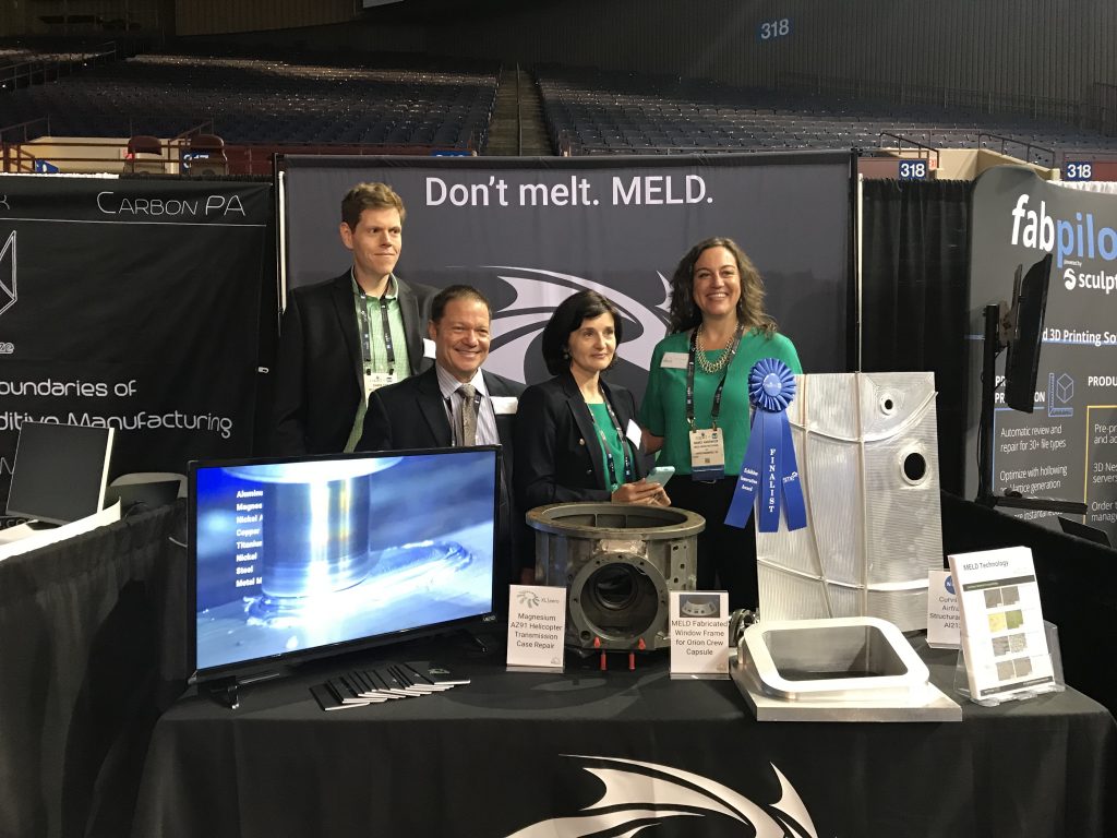 Nanci Hardwick (right) and the MELD Manufacturing team at RAPID + TCT 2018. Photo by Beau Jackson