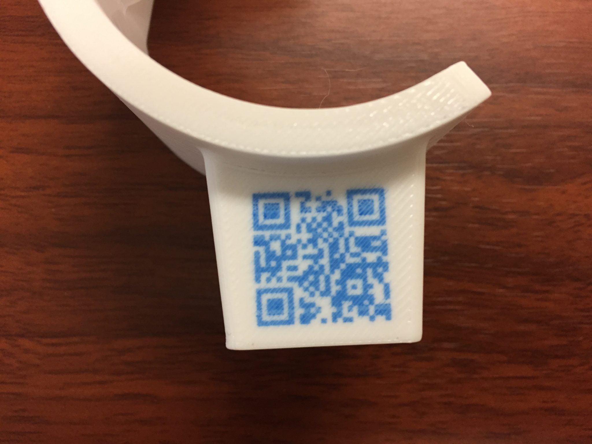 QR code embedded into a 3D printed part. Photo via Rize.