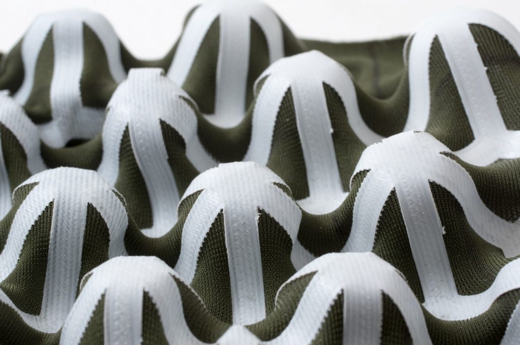 An egg carton type shape 3D printed on fabric. Photo via Gabe Fields and Nervous System.