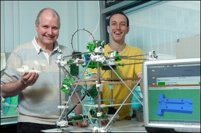 Ed Sells and Dr. Adrian Bowyer with the first RepRap 3D printer. Photo via RepRap