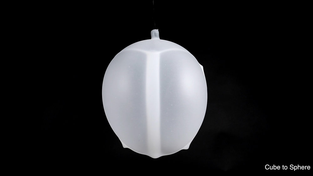 3D printed pneumatic inflates from cube shape to a sphere. Photo via MIT Self-Assembly Lab