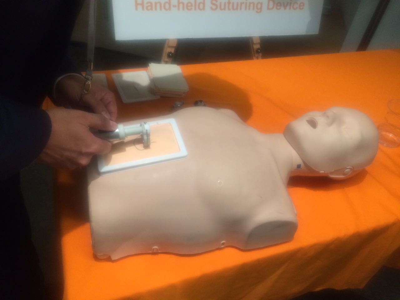 The handheld automated suturing device tested on a surgical mannequin.