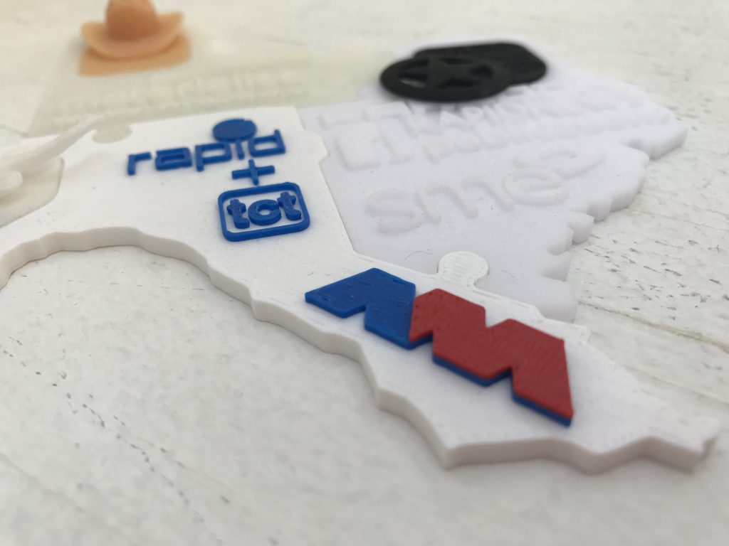 America makes logo on the 3D printed puzzle from RAPID + TCT 2018. Photo by Beau Jackson